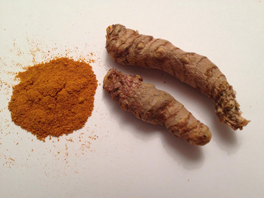 Curcumin essential oil in a violet glass bottle